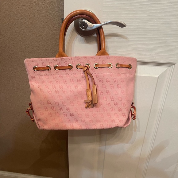 Dooney & Bourke Handbags - DOONEY AND BOURKE light pink signature handbag, logo tassel, canvas/leather EUC